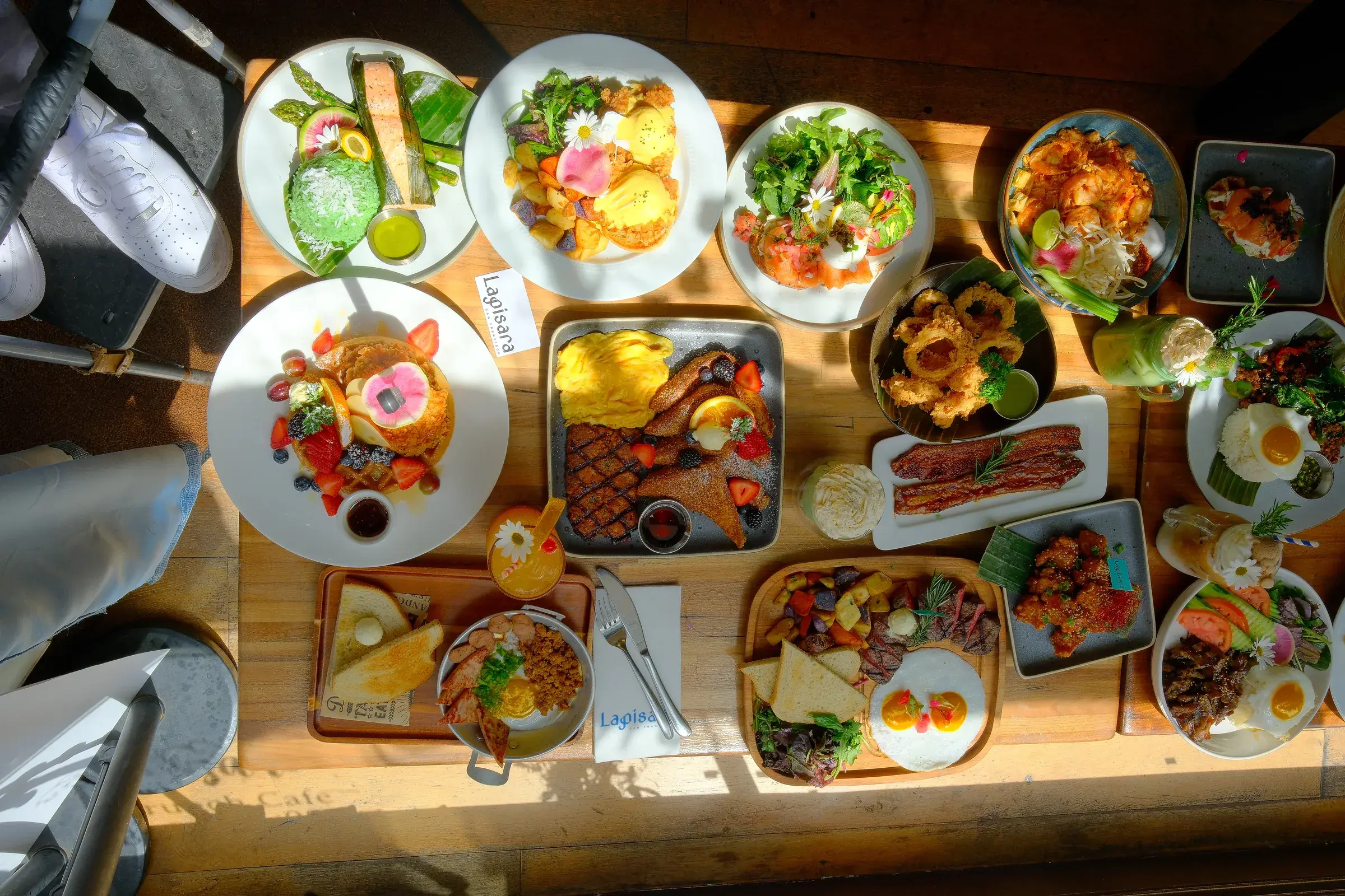 The full brunch menu laid out across a wooden table, seen from above